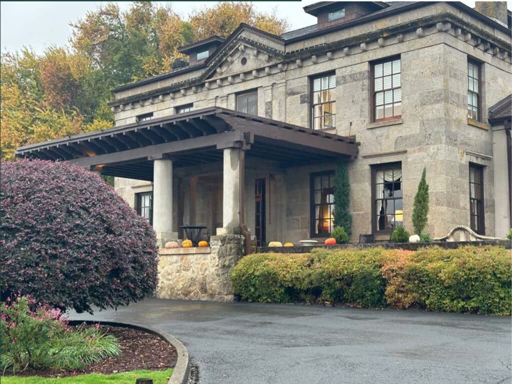 Exterior photo of a traditional stone clubhouse.