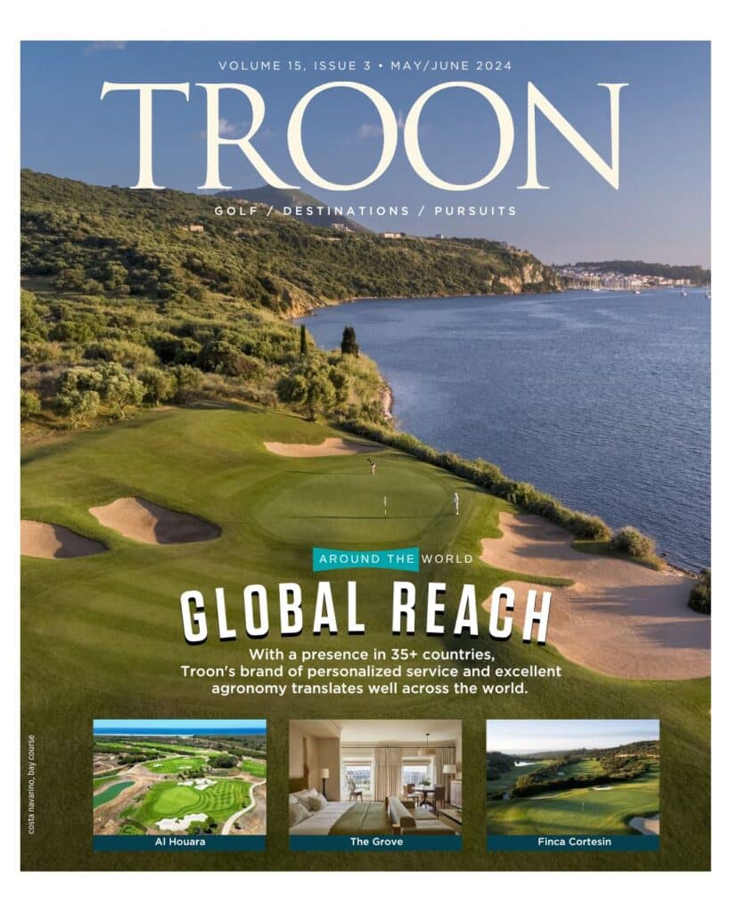 Cover of Troon magazine showing a golf course along the coast.